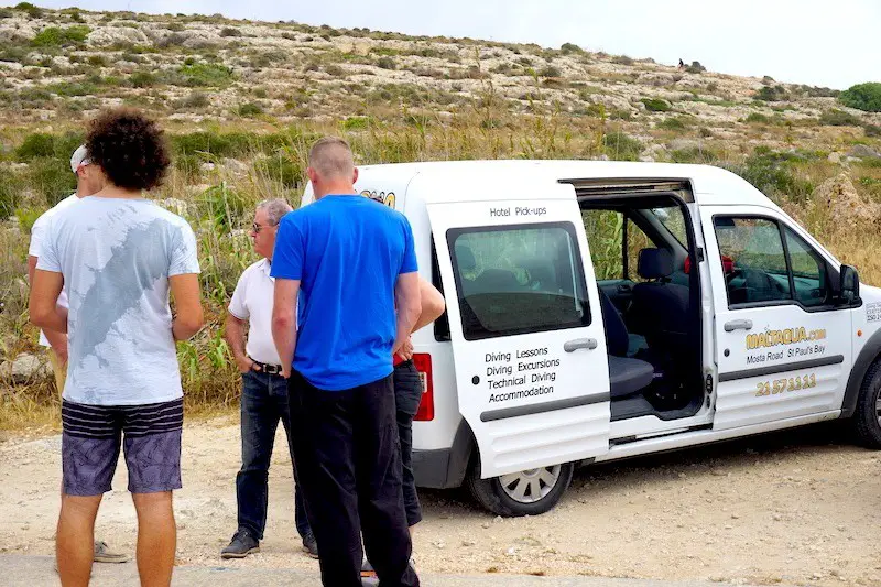 Divers get ready for a coastal cleanup