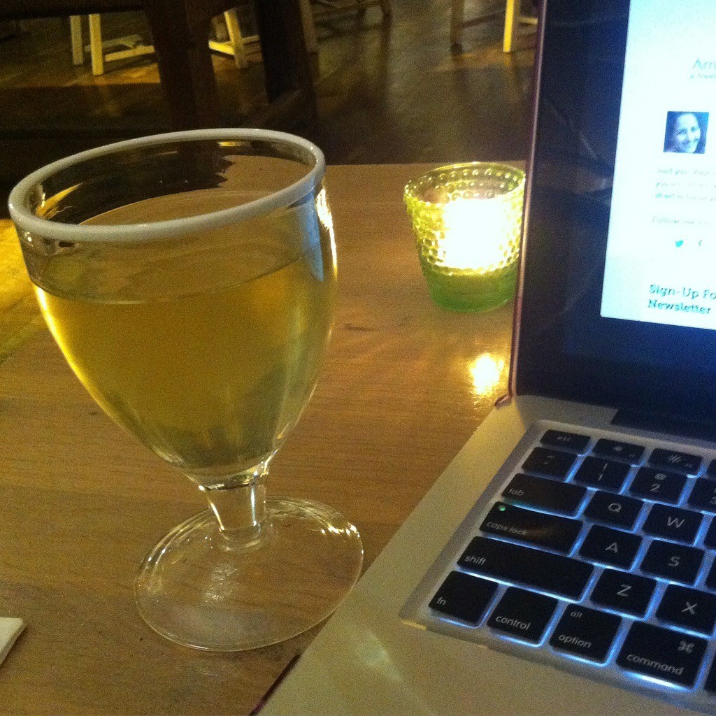 Working as a freelance writer with a glass of wine