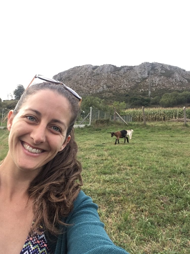 Amanda Walkins with two goats on the hill house and pet sitting in Spain