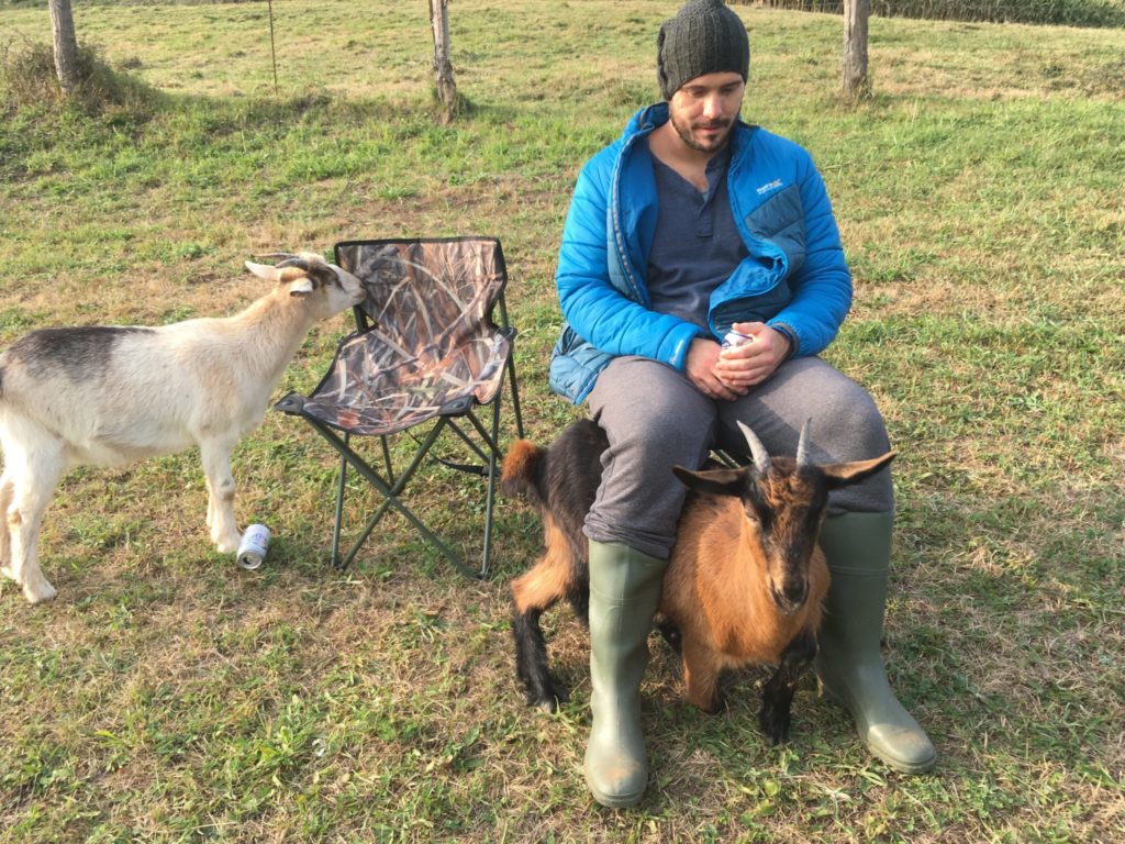 Jonathan Clarkin and two goats hanging out in Spain