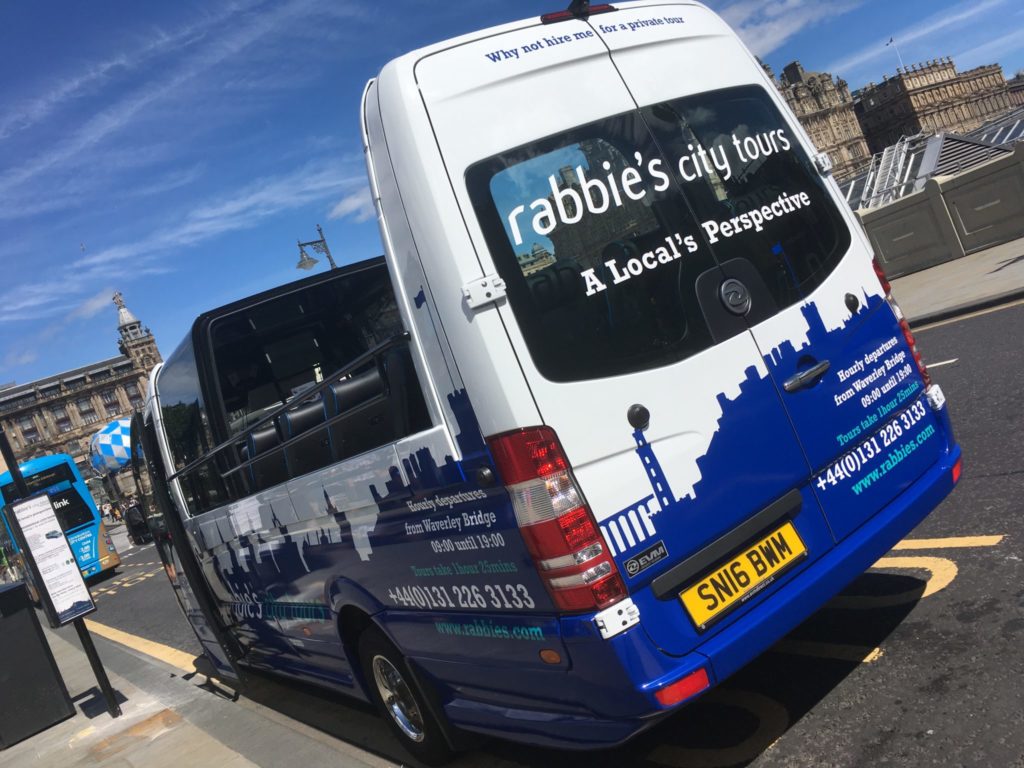 Rabbie's Edinburgh city tour bus with an open rooftop