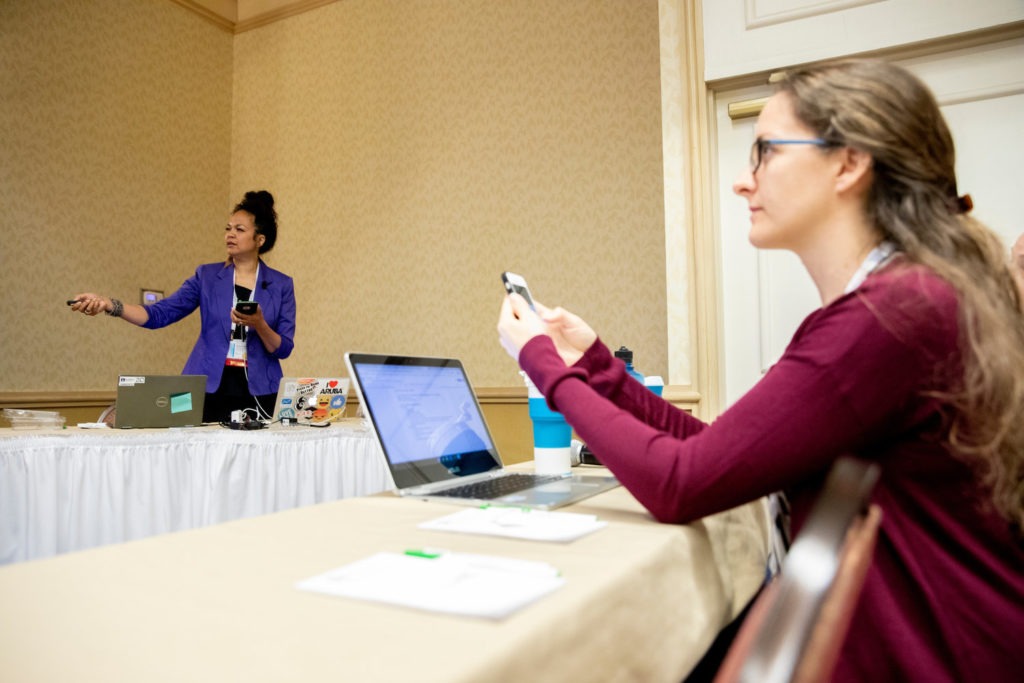 Writer Amanda Walkins taking notes and photos at WITS travel conference