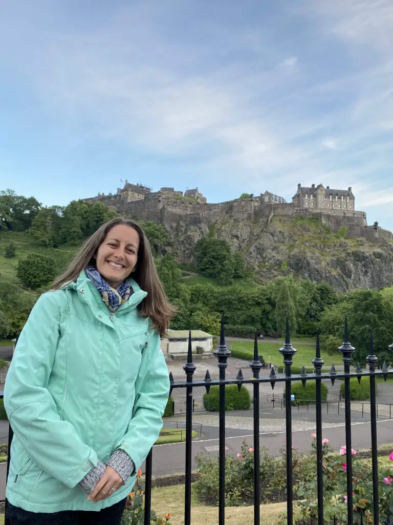 Amanda Walkins posing in front of Edinburgh Castle