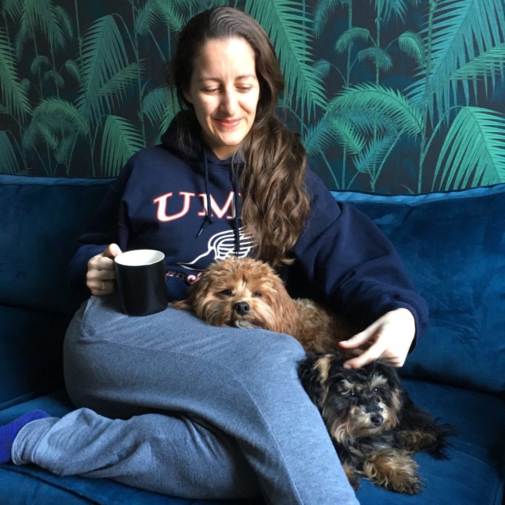 Amanda Walkins lessons learned house sitting with TrustedHousesitters 2 small dogs cuddling her on the couch