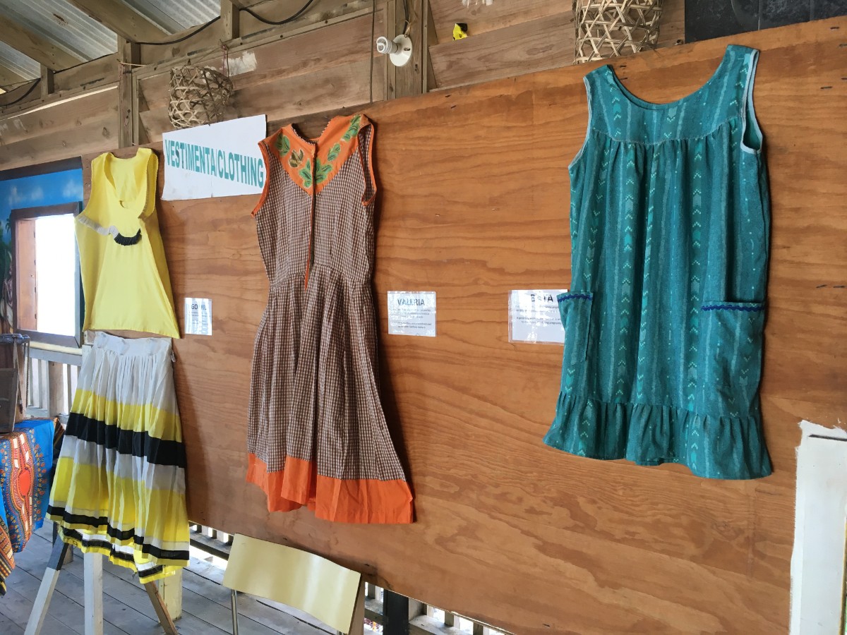 Garifuna clothing hanging on a wall to teach visitors to the Garifuna Cultural Center in Roatan