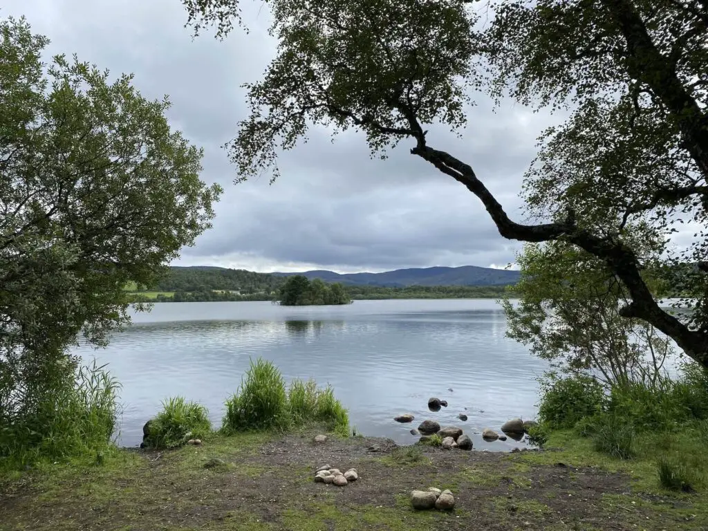 A crannog (a human-made island) rests in Loch Kinord, Muir of Dinnet 