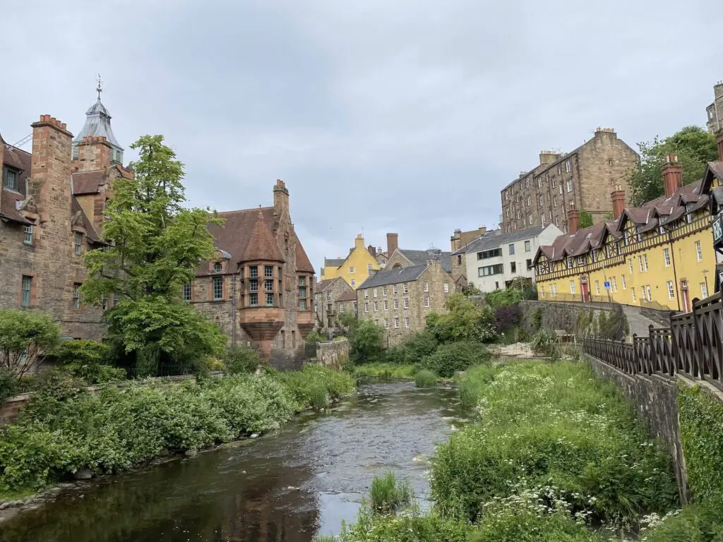 Dean Village in Edinburgh with colorful buildings lining the small riverbanks